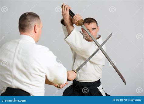 Sword fight stock photo. Image of hands, aikido, body - 142418780