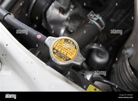 Car radiator cap with warning notice Stock Photo - Alamy