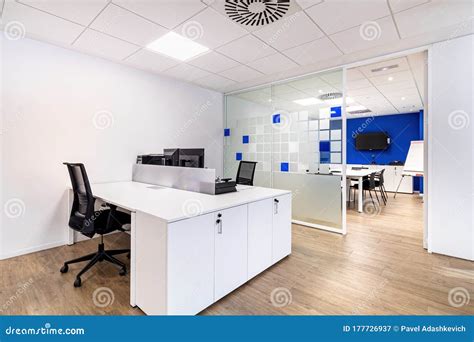 Empty Office with Work Spaces. Modern Office Interior with Blue and White Walls. Meeting Room at ...