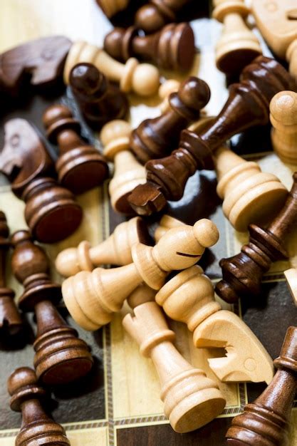 Premium Photo | The chess game pieces on a chess board