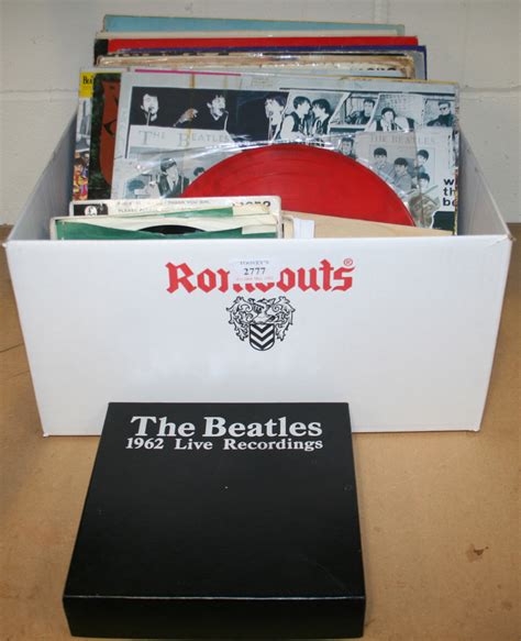 A collection of Beatles records, including the 1962 Live Recordings box set (lacking postcard) and A