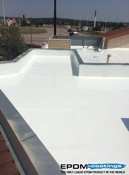 a white flat roof with no cover on it and the words epdm coatings