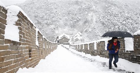 Beijing advises umbrellas to shield against its gross snow