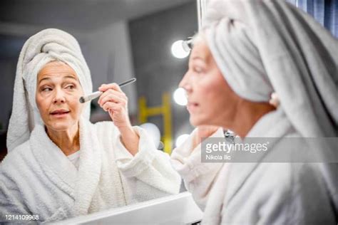 Old Woman Applying Foundation Photos and Premium High Res Pictures - Getty Images