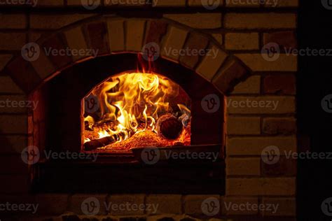 Burning log of wood in a fireplace close-up. 5392456 Stock Photo at Vecteezy