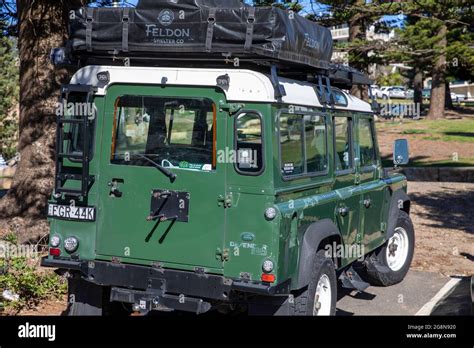 Green Land Rover Defender vehicle with roof rack parked in Sydney,NSW ...