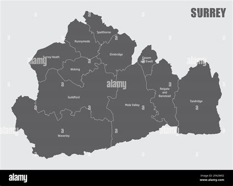 The Surrey county isolated map divided in districts with labels ...