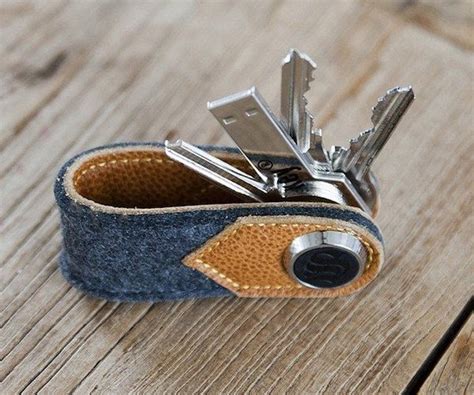 Get beyond the cacophony of jangling keys with the Brown Leather and Wool Felt Key Organizer by ...