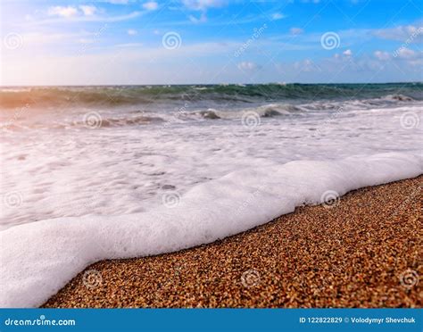 Sea foam on the beach stock image. Image of blue, sunset - 122822829