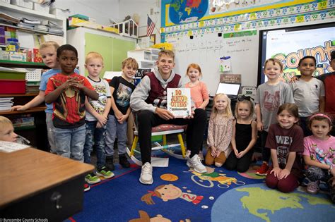 Owen High Football Players Take Time to Read to Primary Students | Charles D. Owen High