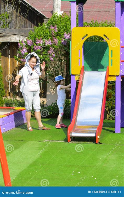 Khust, Ukraine - April 22, 2018. Young Children Run Around Playground ...