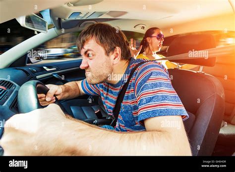 Angry man driving the car Stock Photo - Alamy