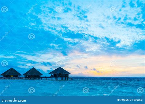 Sunset at maldives island stock photo. Image of resort - 72426176