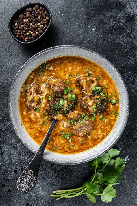 Lamb Soup Kharcho with Mutton Meat, Rice, Tomatoes and Spices in a Bowl. Black Background Stock ...