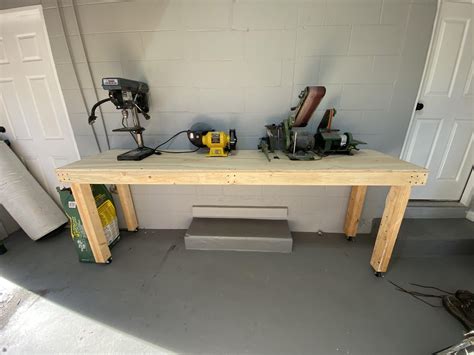 Bought a house, needed a workbench. Today I finally got around to building it. All the 2x4s are ...