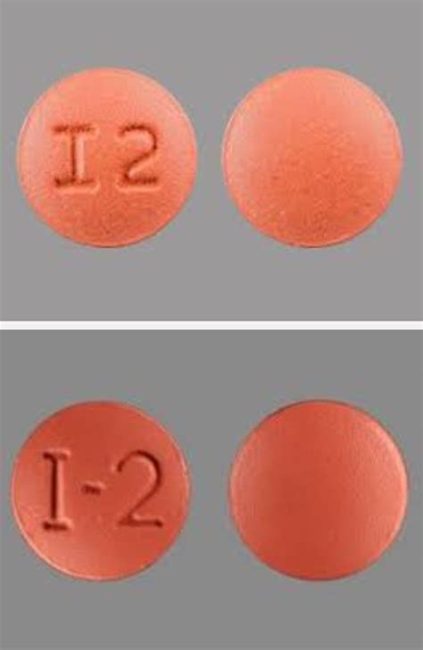 Two pills, one pill is amitriptyline, for treating migraine, and the other is the common ...