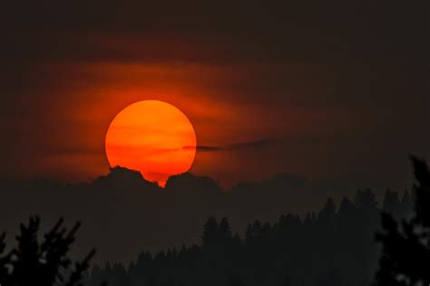 Sunset through wildfire smoke in Montana (notice the sun spots ...