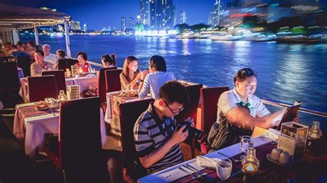 Guests enjoying dinner aboard the Chao Phraya Princess Cruise