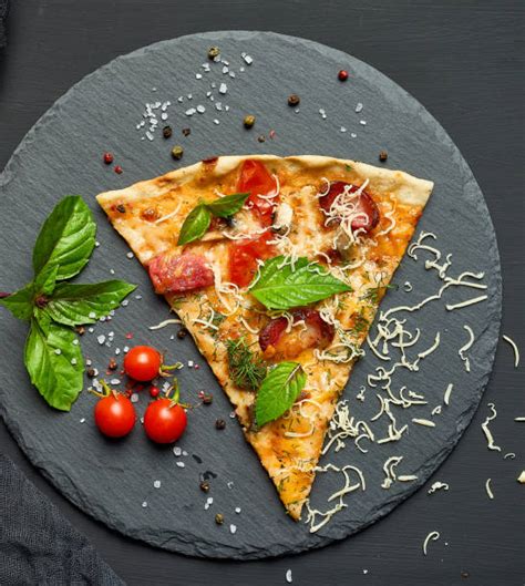 Close Up Of Pizza Triangle Shape Stock Photos, Pictures & Royalty-Free ...