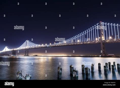 San Francisco-Oakland Bay Bridge illuminated at night Stock Photo - Alamy