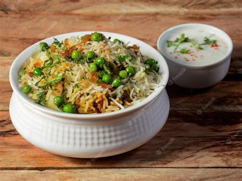 Premium Photo | Traditional hyderabadi vegetable veg dum biryani with mixed veggies served with ...