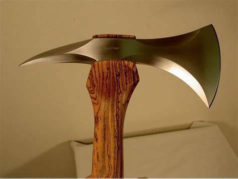 Boarding Axe: this is a contemporary axe with a Zebra wood handle made by Mad Dog Knives. The ...