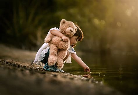 Cute Baby Girl With Teddy Bear Wallpaper