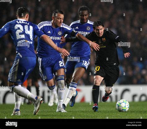 Barcelonas lionel messi right and chelseas john terry in action hi-res ...