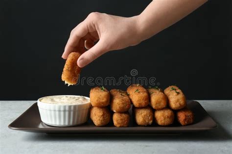 Woman Dipping Cheese Stick into Sauce at Table Stock Image - Image of ...