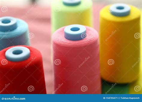 Colorful spools of thread stock image. Image of machine - 154705471