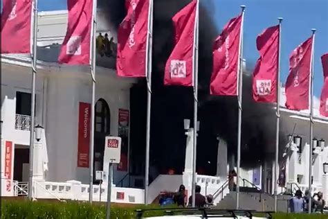 Chants of 'let it burn' as fire breaks out at Old Parliament House in Canberra