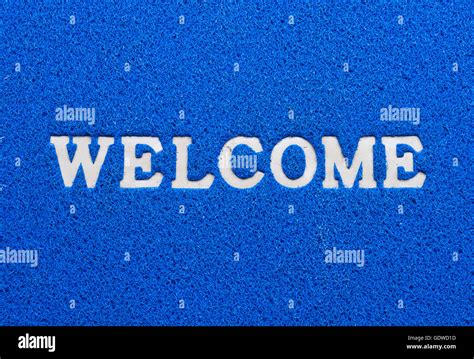 welcome text on blue background Stock Photo - Alamy