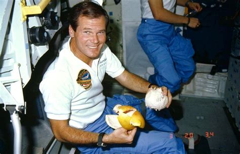 Nelson enjoys a grapefruit aboard the space shuttle Columbia in 1986