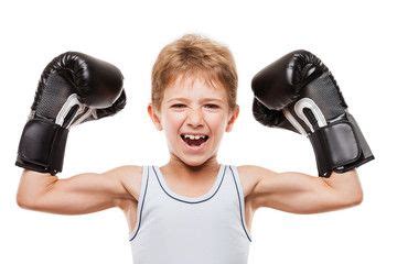 Smiling boxing champion child boy gesturing for victory triumph ...