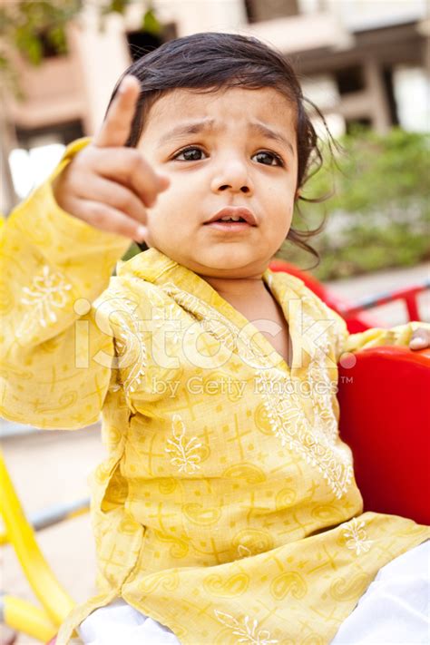 Outdoor Portrait Of Small Pensive Indian Boy Child Stock Photo | Royalty-Free | FreeImages