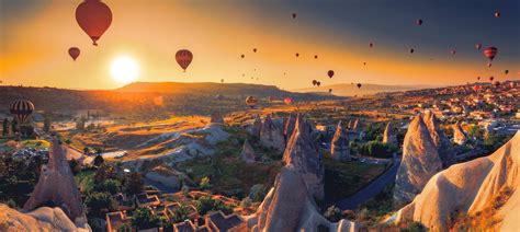 Cappadocia, Turkey. Watching Hot Air Balloons from our cave. [OC][4500x2020] : r/SkyPorn