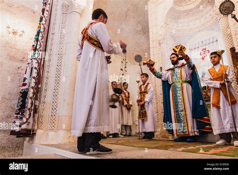 A Syriac Christian priest celebrating mass at an old church in Stock Photo, Royalty Free Image ...