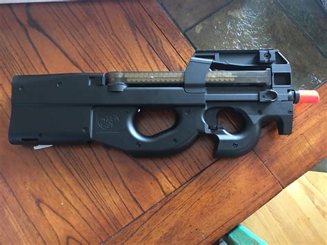 First AEG, a cybergun p90. Was wondering if I should invest a little ...