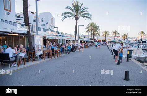 holiday people dining out on the popular calan Bosch marina .Ciutadella ...