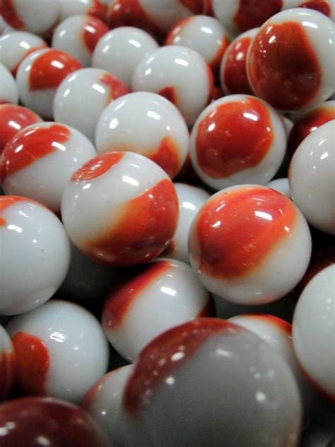 Marble Anyone? | Some red and white marbles out of the many … | Flickr