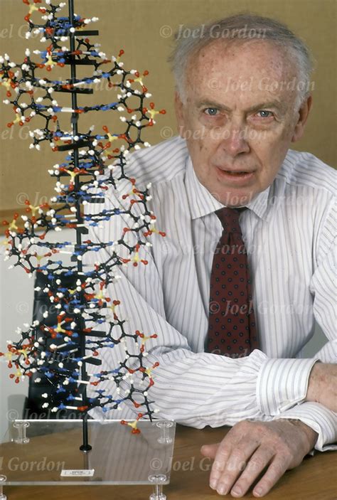 James Watson sitting in front of DNA helix molecules model | Joel Gordon Photography