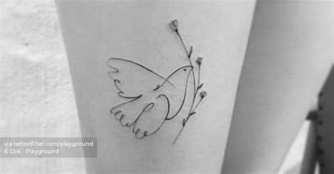 'Dove of Peace' tattoo located on the thigh.