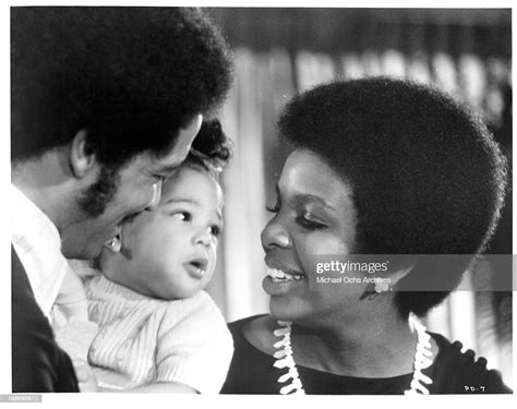 Barry Hankerson and Gladys Knight with a baby in a scene from the ...