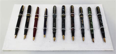 A collection of ten Conway Stewart fountain pens, comprising No. 286 in blue and black marble, No. 3