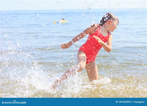 Little Girl Kid Splashing in Sea Ocean Water. Fun Stock Image - Image of relaxing, holiday ...