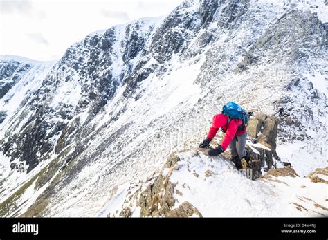 Striding edge winter walker snow hi-res stock photography and images ...