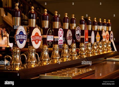 A line of beer taps on the bar of an Edinburgh pub, Scotland Stock Photo - Alamy