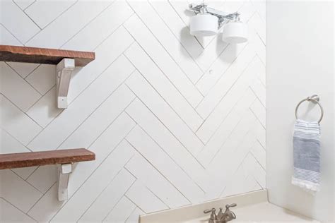 How to DIY a Herringbone Wood Wall on a Budget - Lovely Etc.