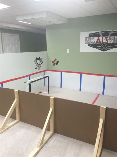 Mini knee hockey rink made by mom using poster board and vinyl plywood. | Hockey room, Basement ...