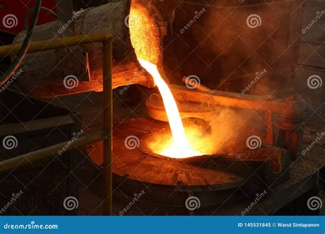 Molten Iron Pour from Ladle into Melting Furnace Stock Image - Image of ...